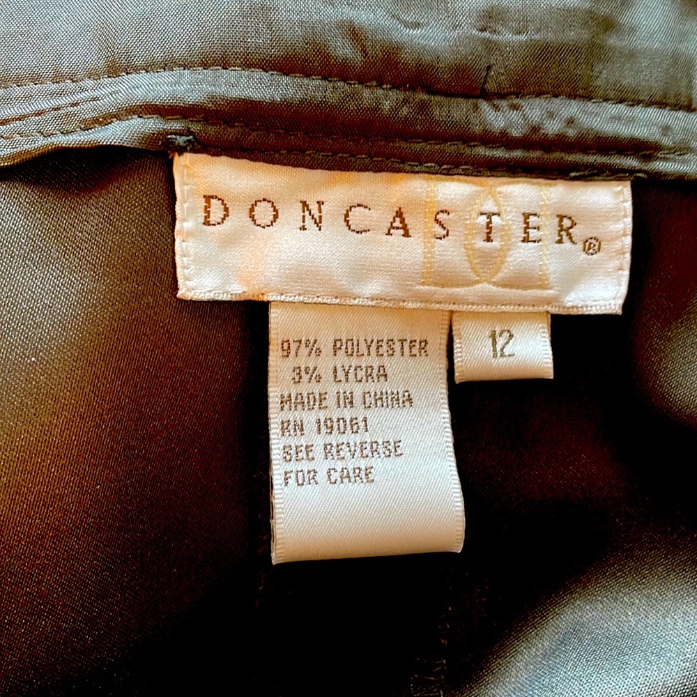 A line olive green.Side zip/button close wide flat waistband multi stitching